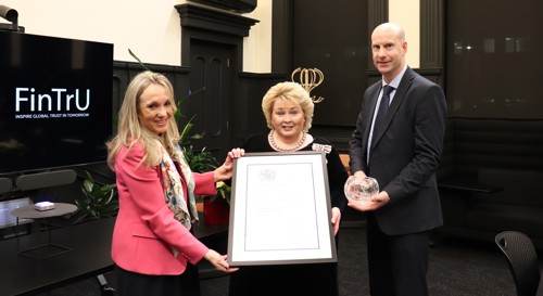 Katrien Roppe, Dame Fionnuala Jay O’Boyle, Steven Murtlan holding an award