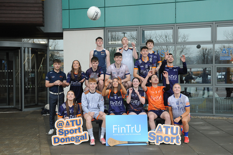 15 people in sports gear in three tiers catching balls